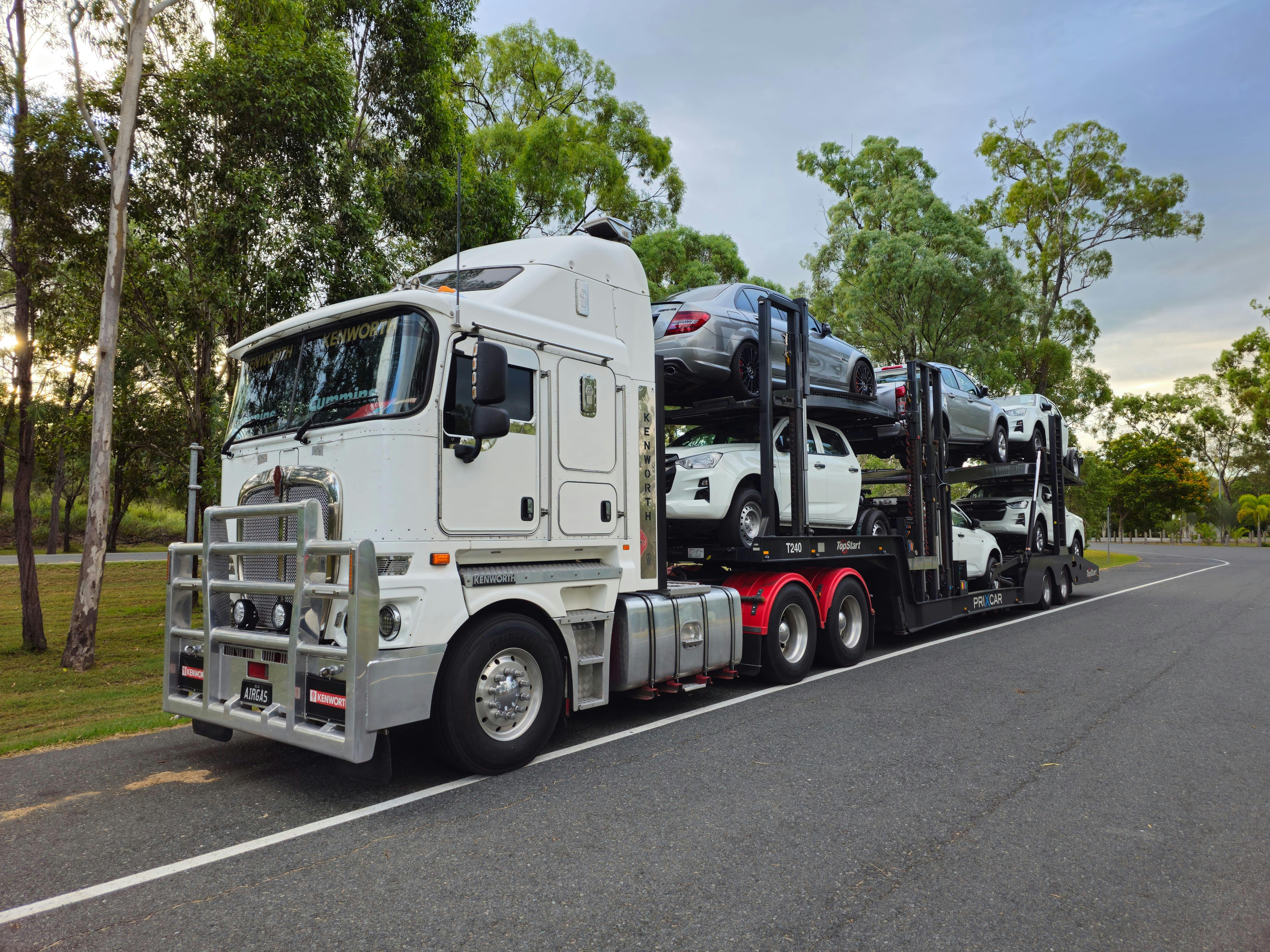 Auto transport carrier driving on an interstate highway across the United States